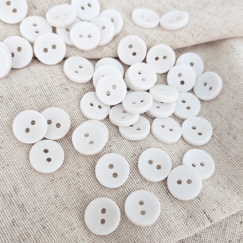 Пуговица P-001. 11.5 мм/2. белый (уп. 12 шт)